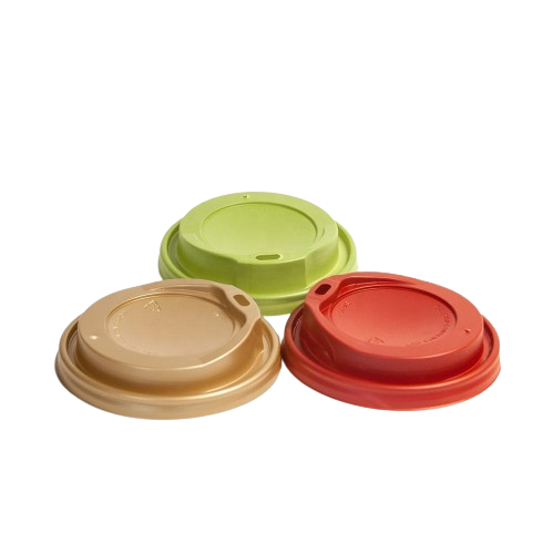 Three colorful plastic coffee cup lids in beige, green, and red arranged in a triangle.