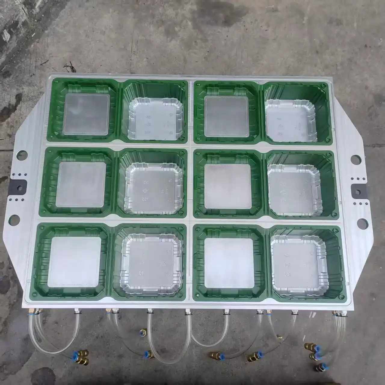 Mesoforming industrial mold with 12 green cavities and aluminum trays