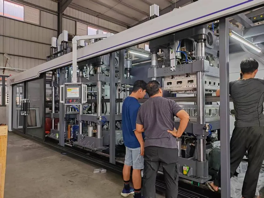 Mesoforming Thermoforming Machine inspection, global clients reviewing automated production system